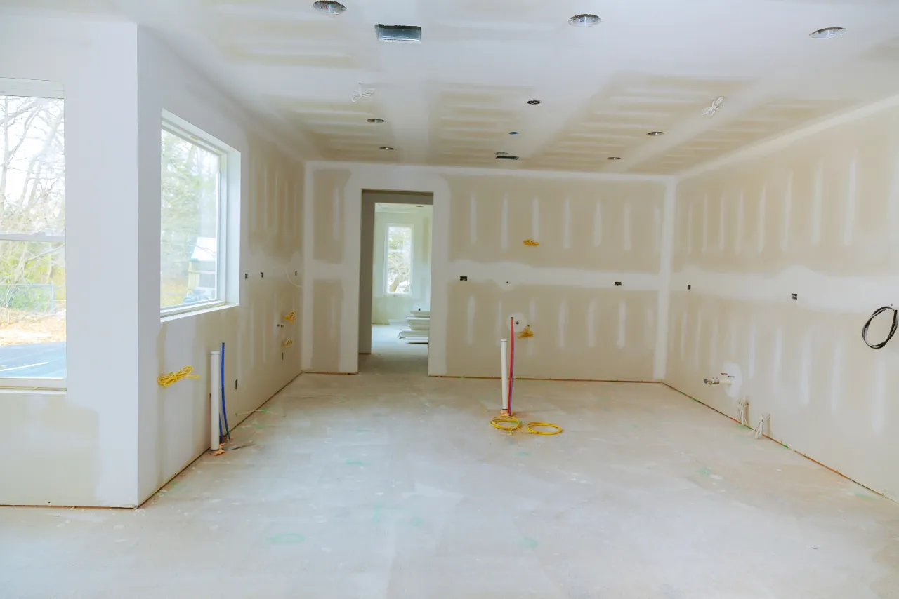 Framed basement construction awaiting drywall in Massachusetts