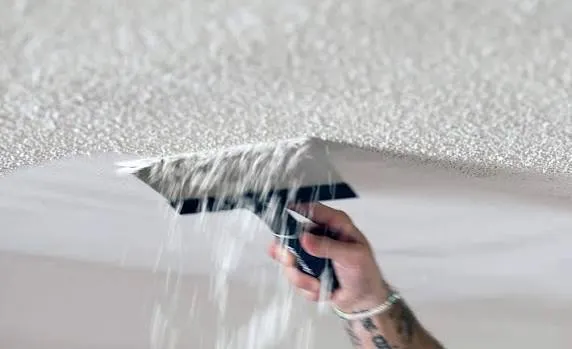 Scraping popcorn texture off a ceiling and skim coating in Massachusetts