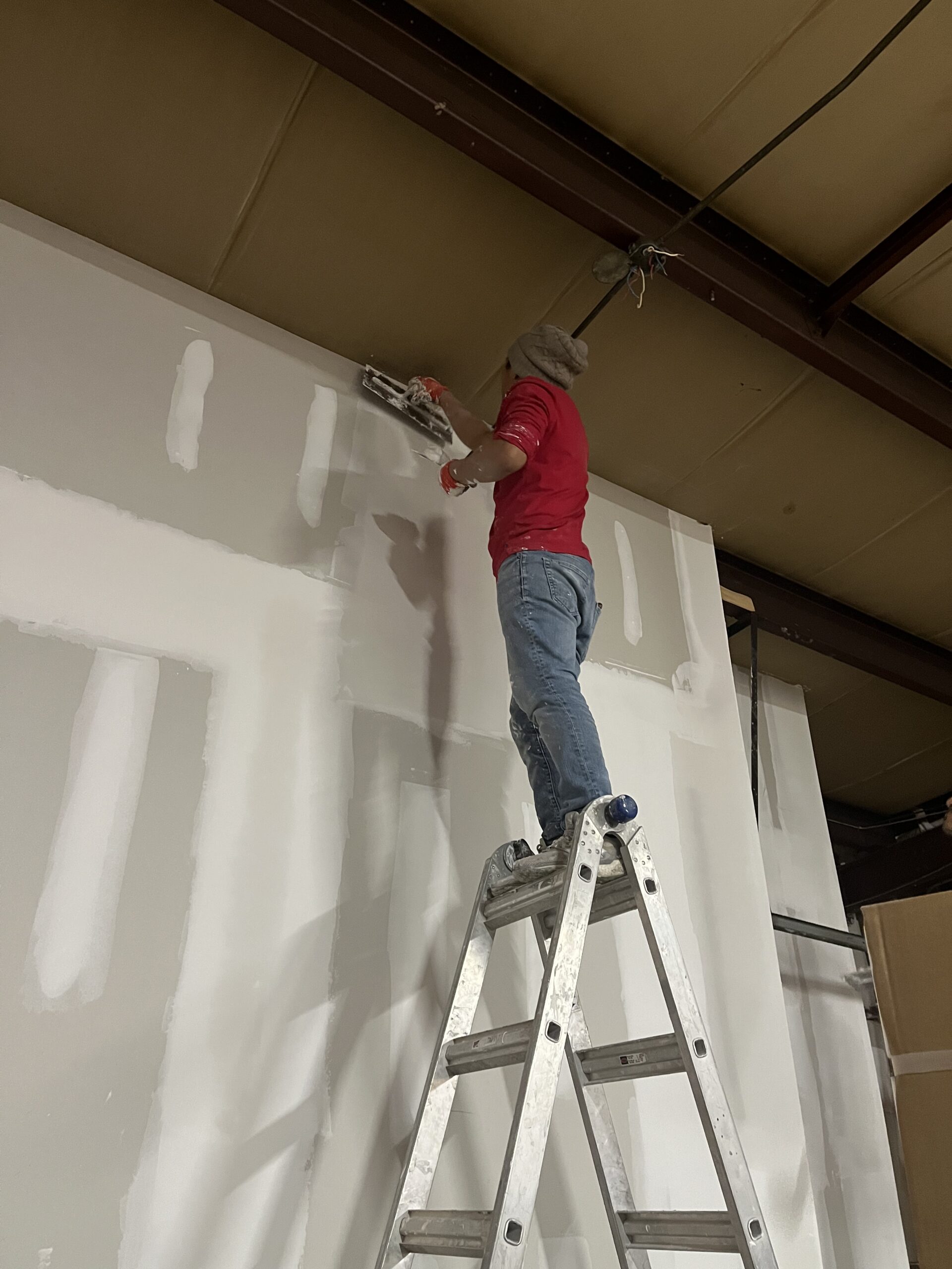Interior surfaces prepped for primer and paint in a Massachusetts home